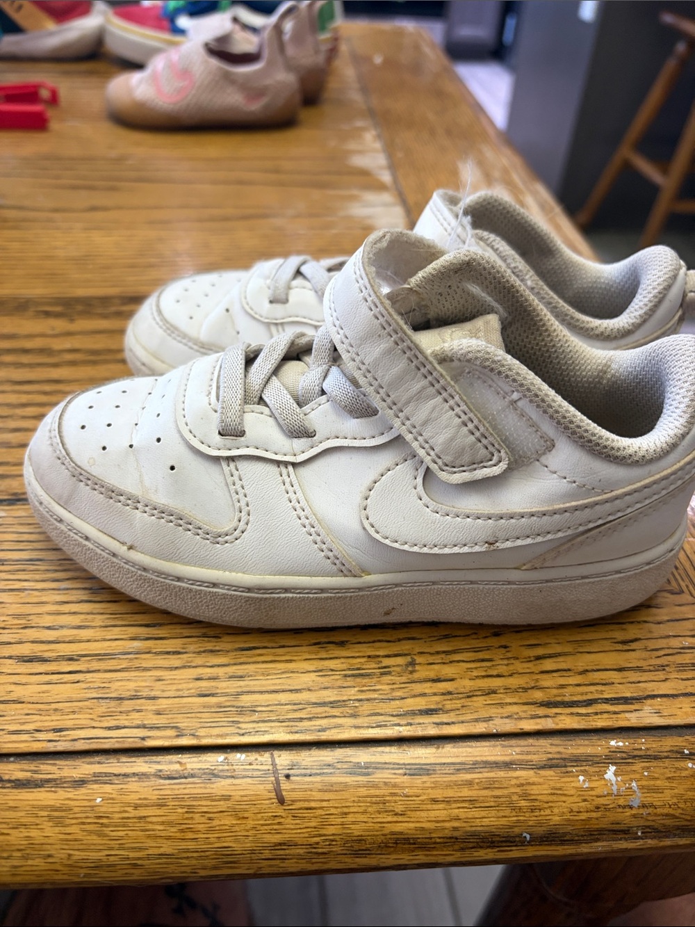 Nike size 10 Kids White Velcro Sneakers with Low-Top Design